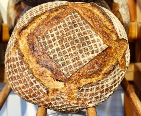 Large cooked bread with square pattern.